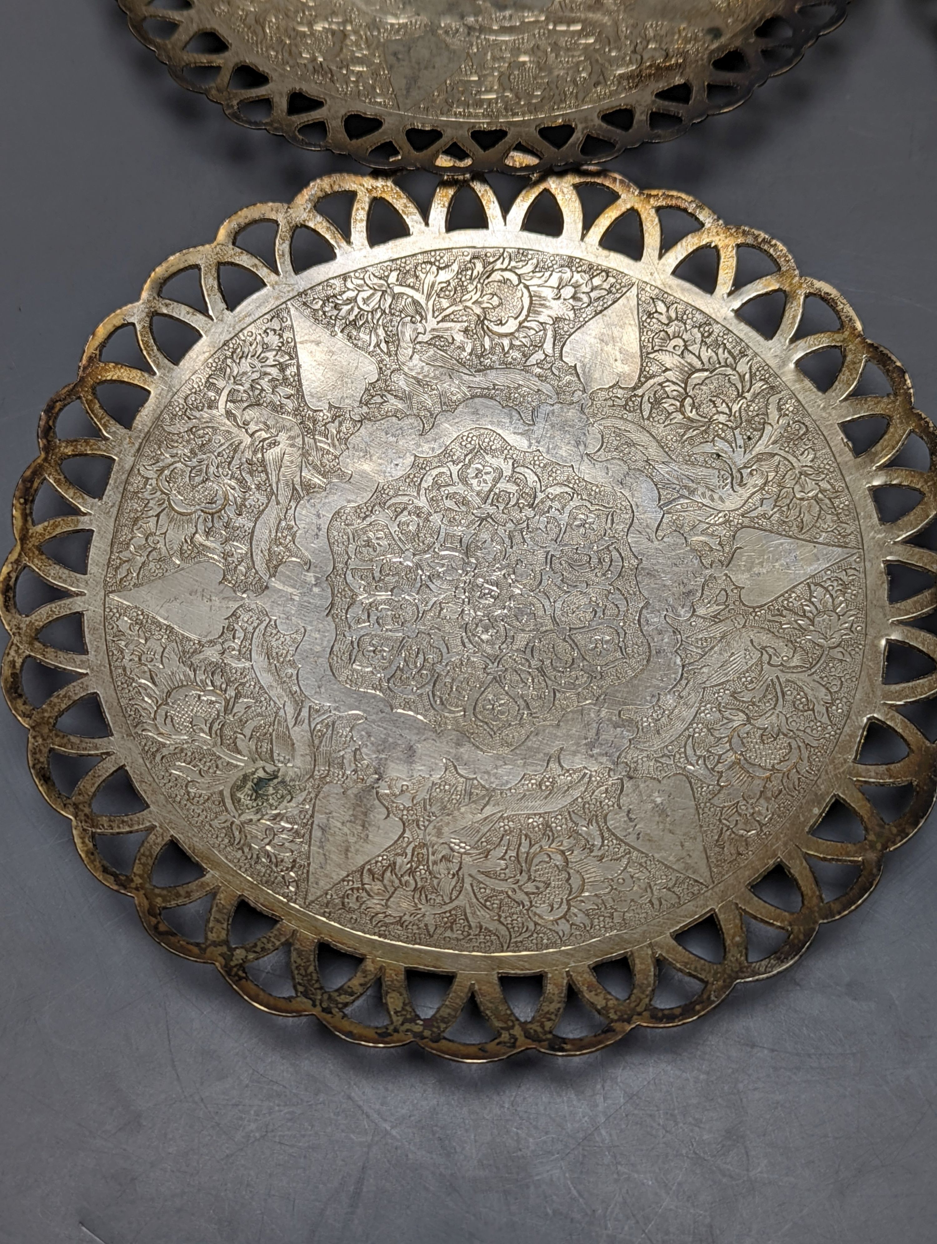 A set of six Persian white metal circular shallow dishes, with pierced borders, 16.3cm, 972 grams.